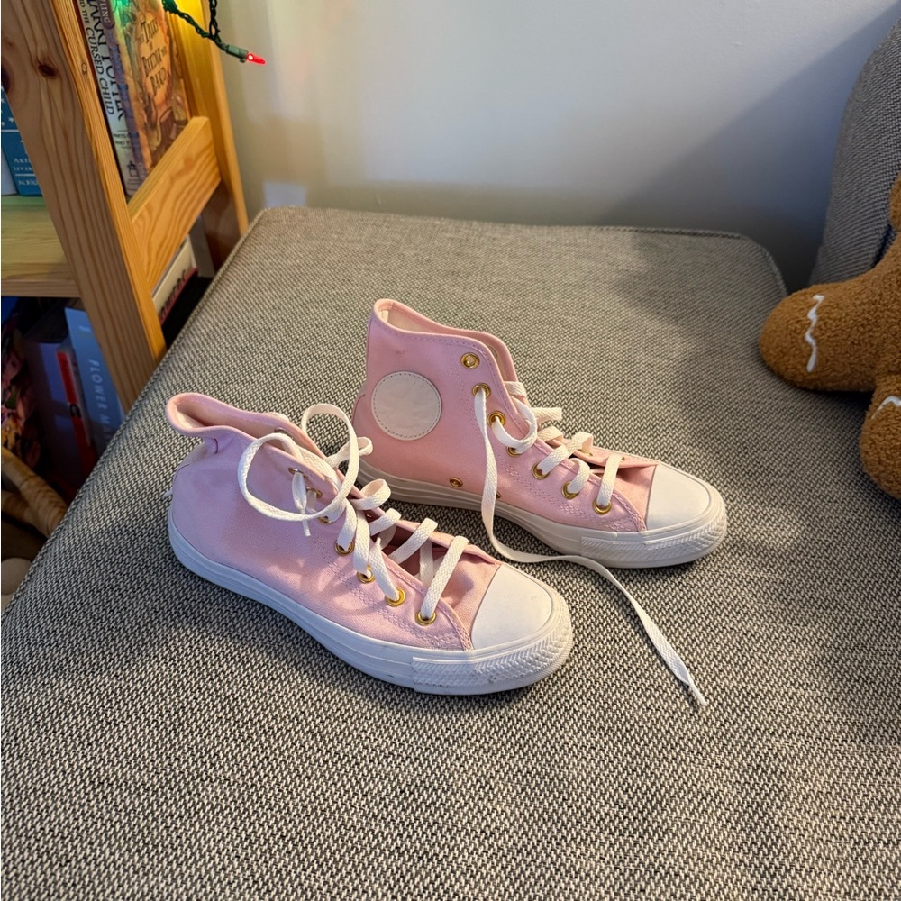 Custom pink converse with gold eyelets